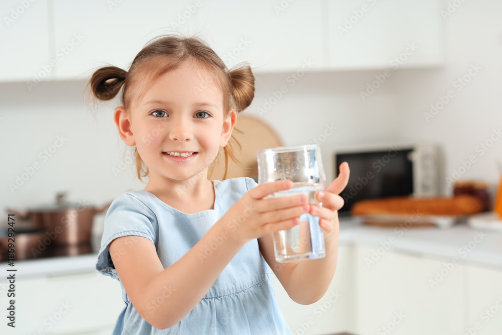 Cute little girl with glass of water in kitchen, closeup Cute little girl with glass of water in kitchen, closeup