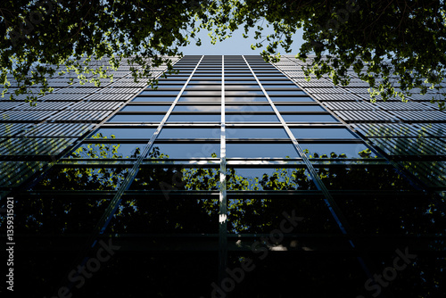 Modern Glass Facade Reflecting Trees and Sky - 3D Illustration (no AI)