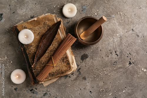 Old book, incense sticks, c...