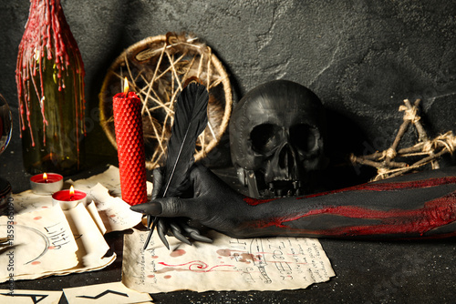 Bloody witch hand with magi...