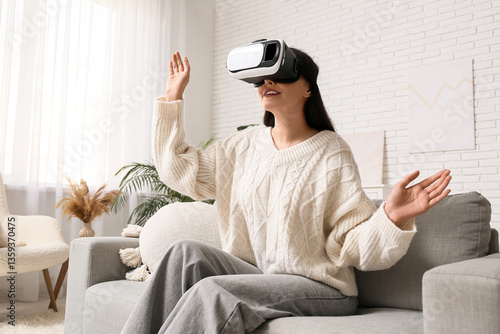 Young woman using VR glasse...