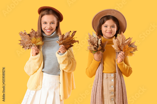 Cute girls in autumn clothe...