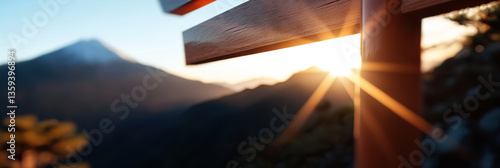 Mountain Sunrise Viewed Through Wooden Structure photo