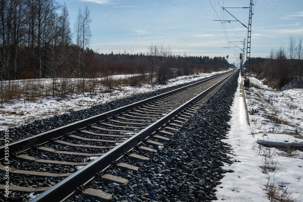Fototapeta premium Empty train tracks in early springtime, Kempele Finland