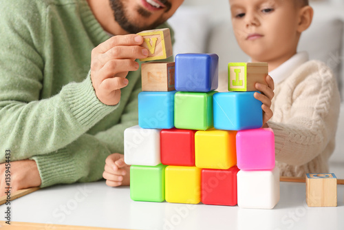 Father and son building col...