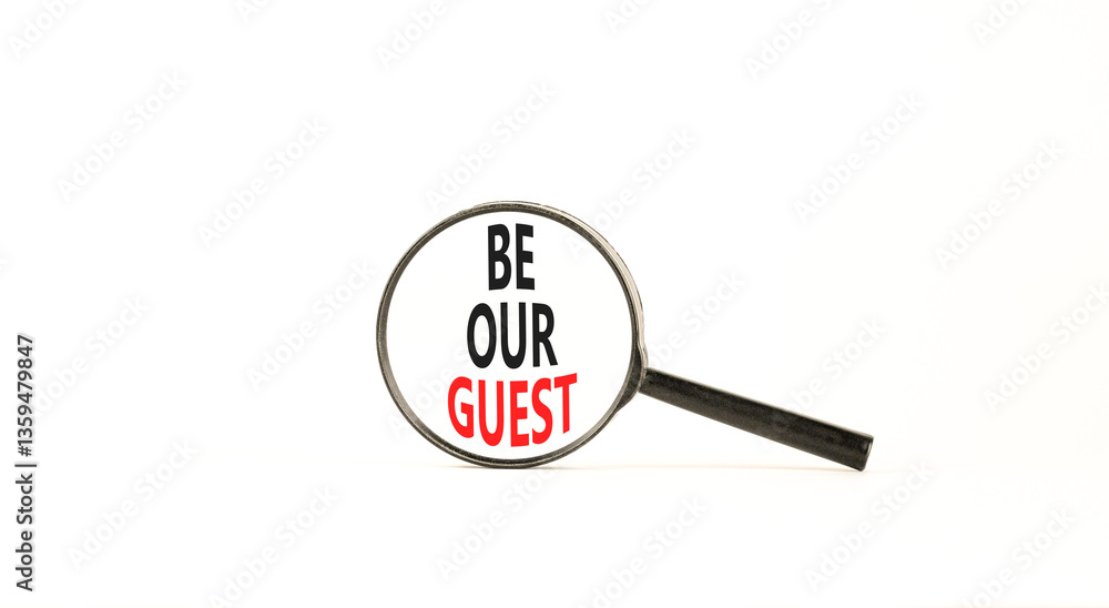 Be our guest symbol. Concept words Be our guest on beautiful white paper in magnifying glass. Beautiful white paper background. Business and be our guest concept. Copy space. Be our guest symbol. Concept words Be our guest on beautiful white paper in magnifying glass. Beautiful white paper background. Business and be our guest concept. Copy space.