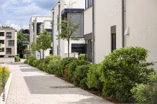 Residential Buildings Landscaping in Germany. Modern Apartment Buildings with Green Bushes and Trees. Residential Neighbourhood Landscape.