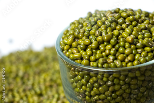Obraz na plátně Closeup of Green Moong Dal beans in a Glass Bowl Isolated on a white background