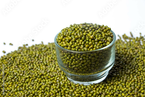 Fotografie Green Moong Dal beans in a Glass Bowl Isolated on a white background