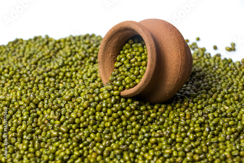 Fotografie Green Moong Dal beans in a earthen clay pot Isolated on a white background