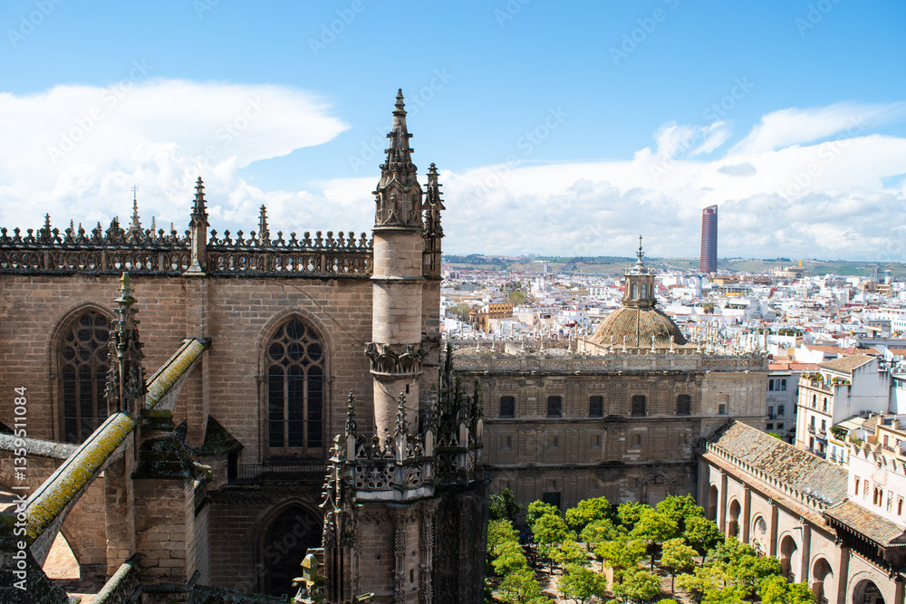 Fototapeta premium Cityscape view of the city of Seville, Spain taken from the La Giralda tower and spire at Seville cathedral.