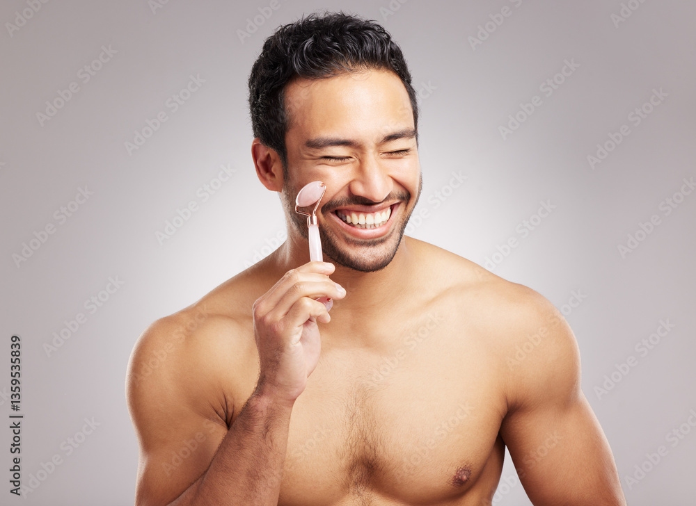 Fototapeta premium Studio, man and facial with roller for skincare, blood circulation or dermatology for wellness. White background, male person and model with quartz tool for beauty, face massage or lymphatic drainage
