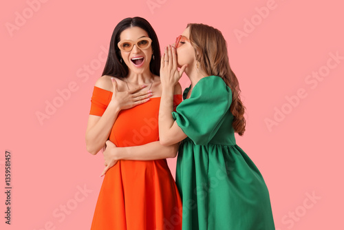 Stylish young women in brig...