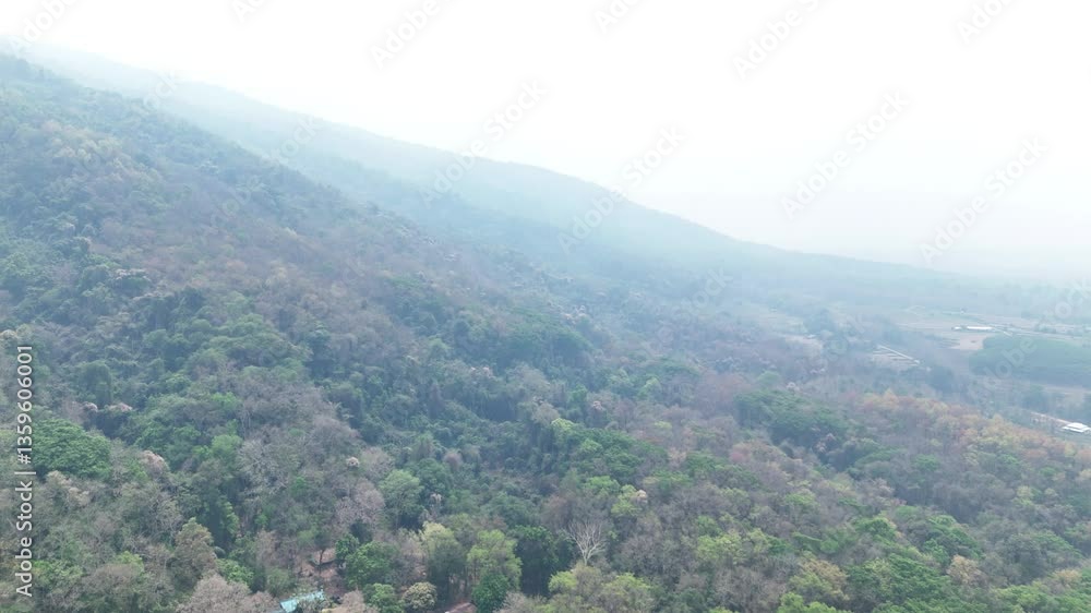 The sky covered with bad air pollution such as PM 2.5. Nan province of Thailand. The weather is toxic smog PM 2.5. Pollution in the northern part of Thailand. The smog floats on the residential area. The sky covered with bad air pollution such as PM 2.5. Nan province of Thailand. The weather is toxic smog PM 2.5. Pollution in the northern part of Thailand. The smog floats on the residential area.