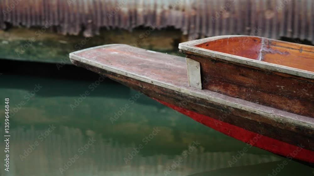 Wooden Boat Sailing On The River Of Damnoen Saduak Floating Market Near Bangkok, Thailand. Close-up Shot Wooden Boat Sailing On The River Of Damnoen Saduak Floating Market Near Bangkok, Thailand. Close-up Shot