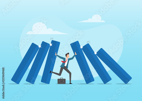 A businessman using his hand to stop dominoes and foot to stop others