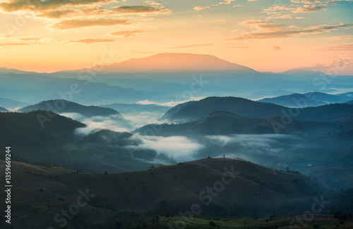 Golden sunrise shining over Doi Inthanon and foggy mountain on harvest season