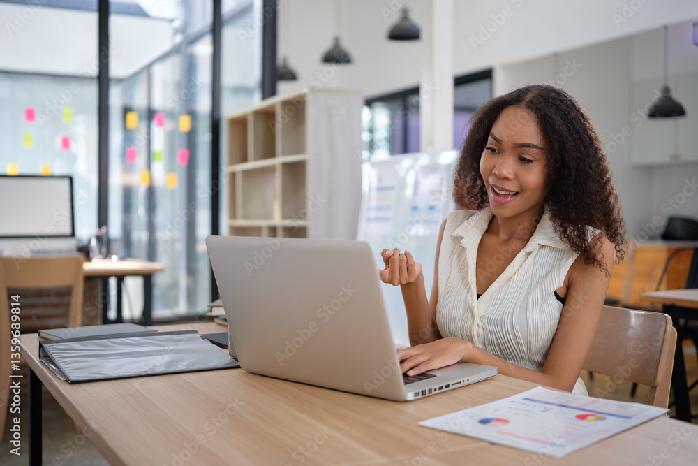 Confident young businesswoman actively participates in a video conference call from her modern office. Confident young businesswoman actively participates in a video conference call from her modern office.