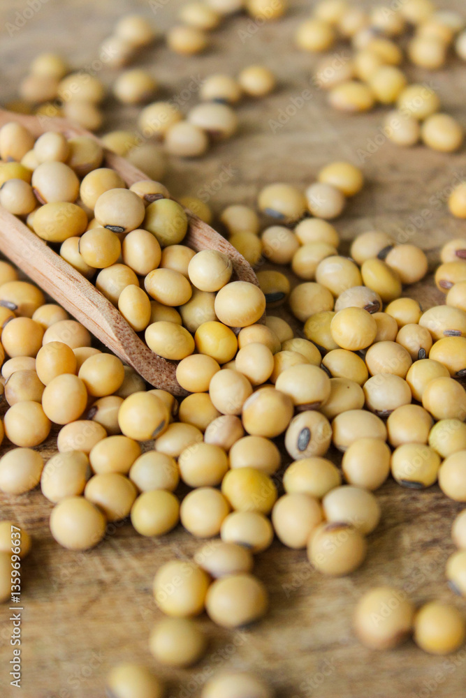 Fresh soybeans on a wooden shovel spoon with wooden background. Raw soybeans. Food ingredients Fresh soybeans on a wooden shovel spoon with wooden background. Raw soybeans. Food ingredients
