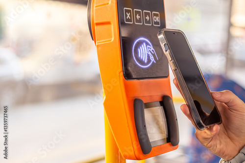 Paying for public transport by card. Public transport. Contactless fare payment.
