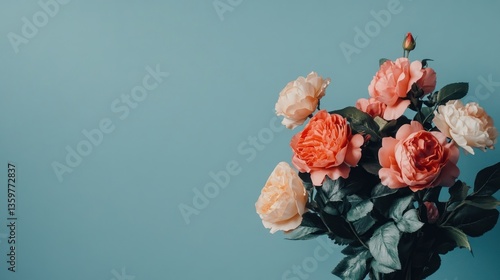 Pink and Peach Roses against a Blue Background