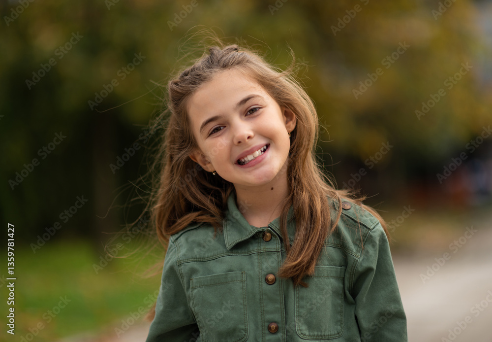 Portrait of a happy child girl outside, in the spring park. Portrait of a happy child girl outside, in the spring park.