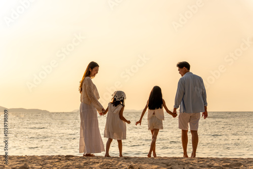 Happy family beach vacations.Group of multi generation family little girl with parents and grandparents relax and enjoy together on the beach.