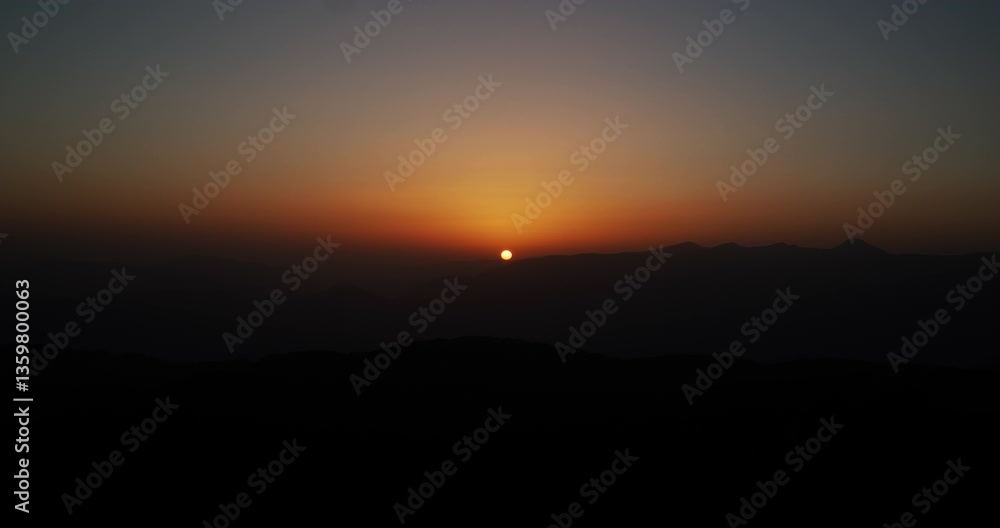 Beautiful warm sunset in Turkish mountains of the Kemer Region shot from the observation deck on Tahtali Mountain. Beautiful warm sunset in Turkish mountains of the Kemer Region shot from the observation deck on Tahtali Mountain.