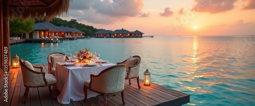 Fototapeta Naklejka Na Ścianę i Meble -  Extraordinary romantic dinner on the beach on a wooden deck adorned with candles beneath a sunset sky. Romance and love, luxury destination dining, exotic table arrangement with a view of the sea.
