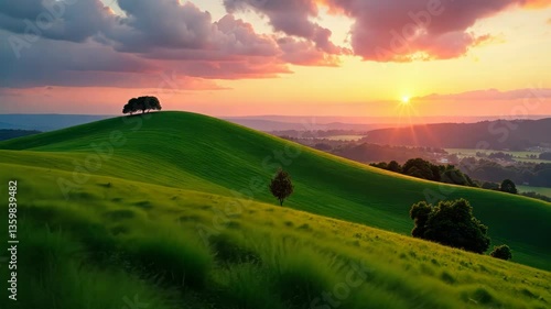 Serene Sunset Over Rolling Green Hills with Lush Grass and Trees
