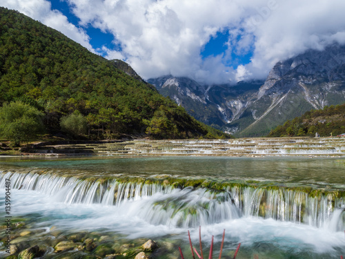 Vibrant turquoise waters of Blue Moon Valley, nestled at the base of the majestic Jade Dragon Snow Mountain in Lijiang, Yunnan Province, China