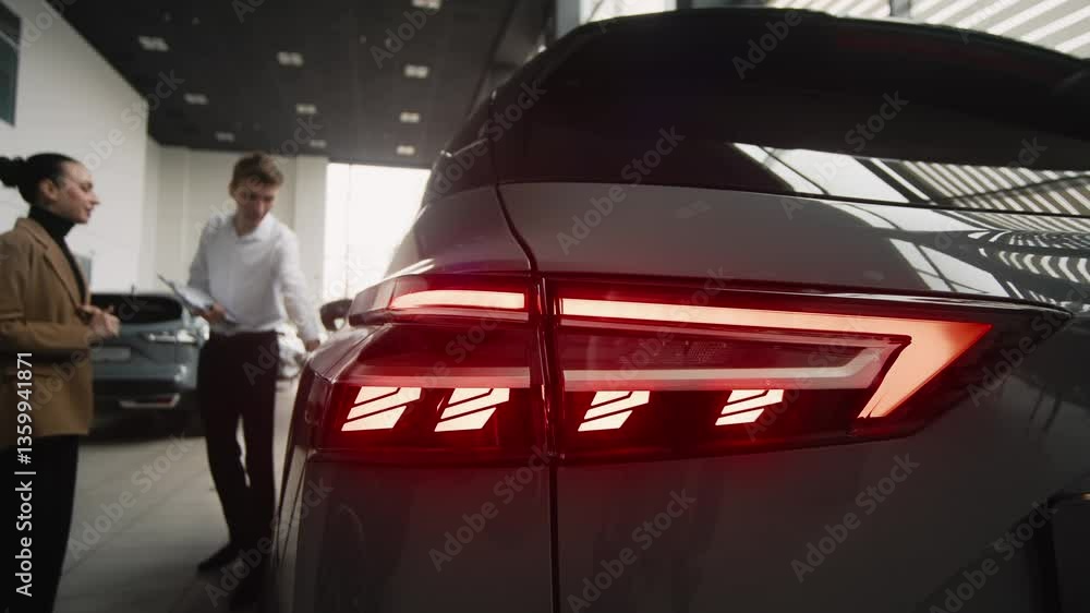 A car dealer in a stylish, modern showroom consults a client on buying or renting a new car. Concept a seamless, professional experience that highlights trust, quality, and customer satisfaction.