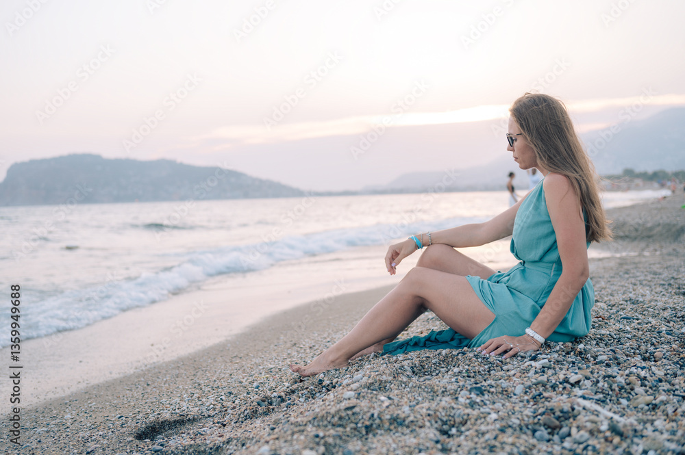 Woman in Flowing Dress on Seaside Pier Woman in Flowing Dress on Seaside Pier