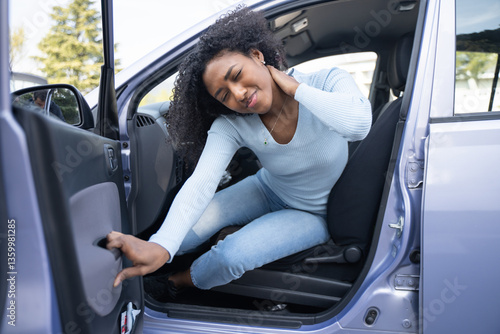 A black woman in a car after a accident