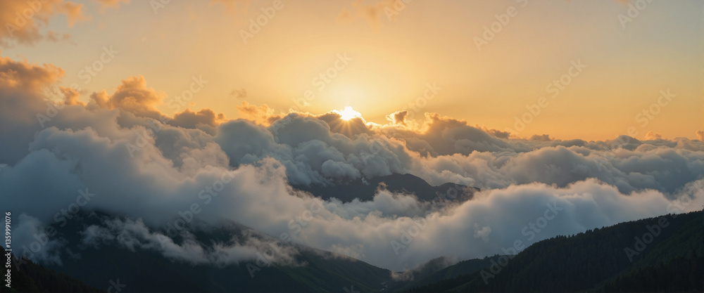 Fototapeta premium Dramatic sunset over misty mountain range, serene nature landscape