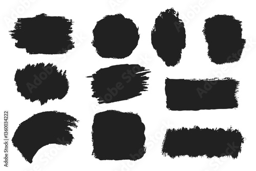Set of abstract grunge paint shapes in black ink on white background