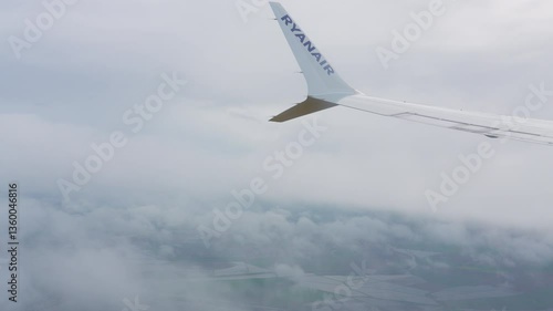 Approaching Lisabon during cloudy skies with views of the lush countryside and fields below