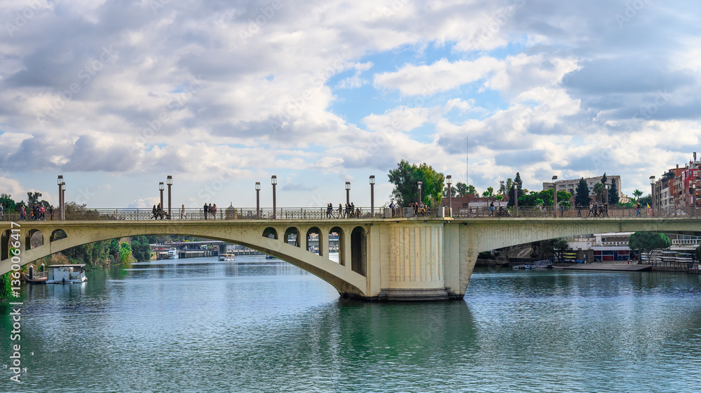 The San Telmo Bridge spans the Guadalquivir River, Seville, Spain The San Telmo Bridge spans the Guadalquivir River, Seville, Spain