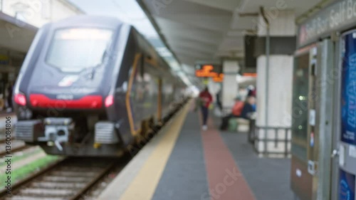 Wallpaper Mural Blurred train at station with waiting passengers on rainy day with modern design in urban area highlighting transportation and travel atmosphere Torontodigital.ca