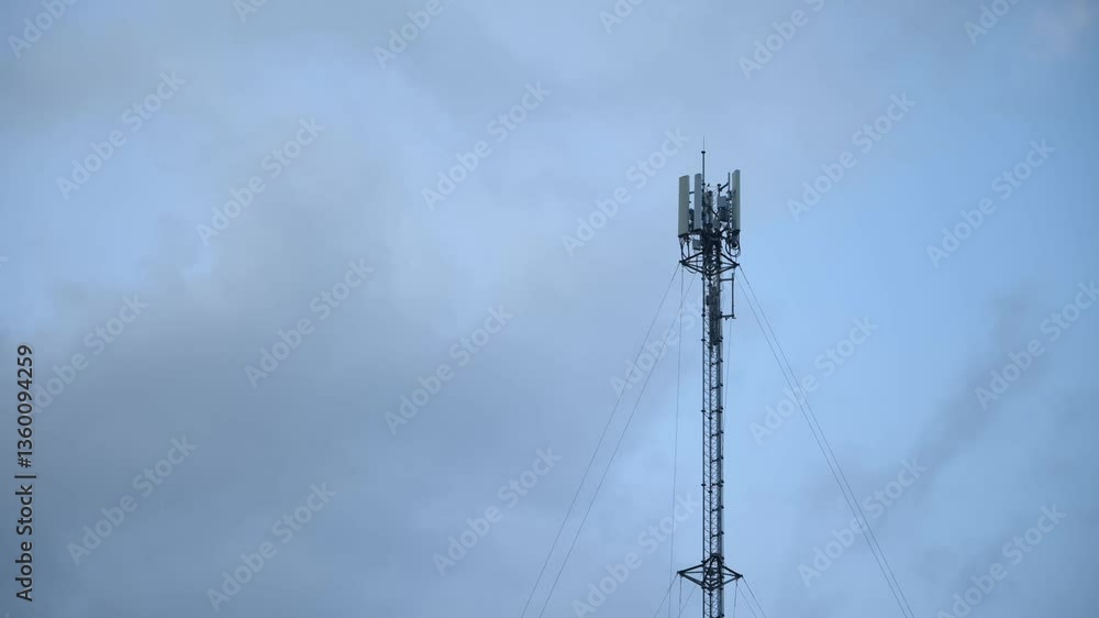 Timelapse view of tower antennas Telecommunication cell phone, radio transmitters of cellular 5g mobile and smartphones. Camera zoom in motion Timelapse view of tower antennas Telecommunication cell phone, radio transmitters of cellular 5g mobile and smartphones. Camera zoom in motion