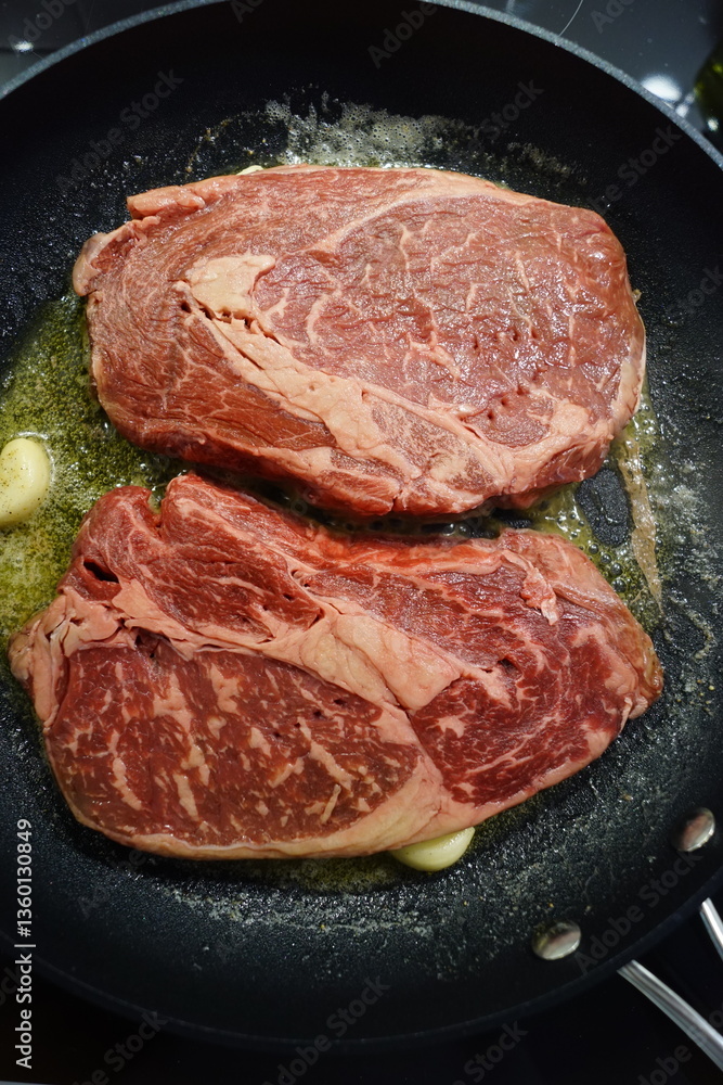 Close up of a juice beef steak being cooked Close up of a juice beef steak being cooked