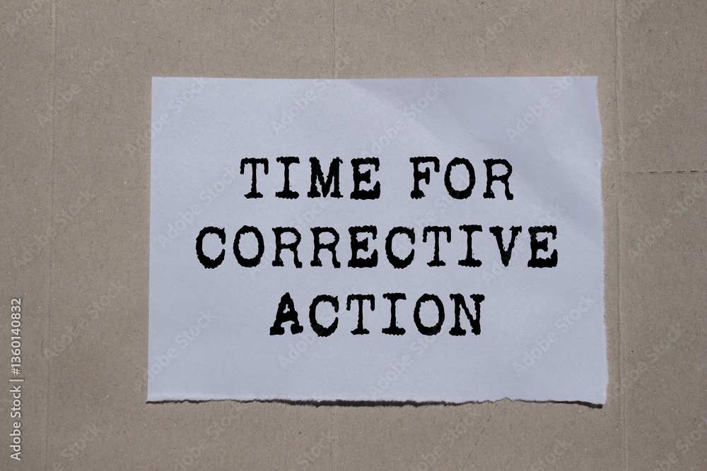 Obraz premium Time for corrective action message written on ripped torn paper on cardboard background. Conceptual time for corrective action symbol. Copy space.