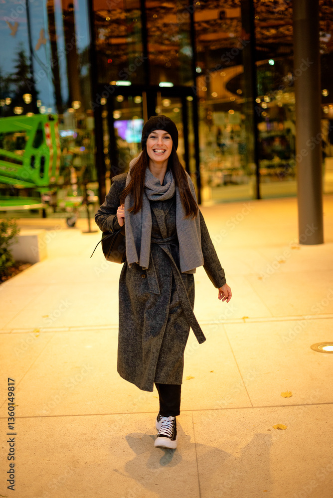 Fototapeta premium Smiling mature woman standing outdoor on an autumn day