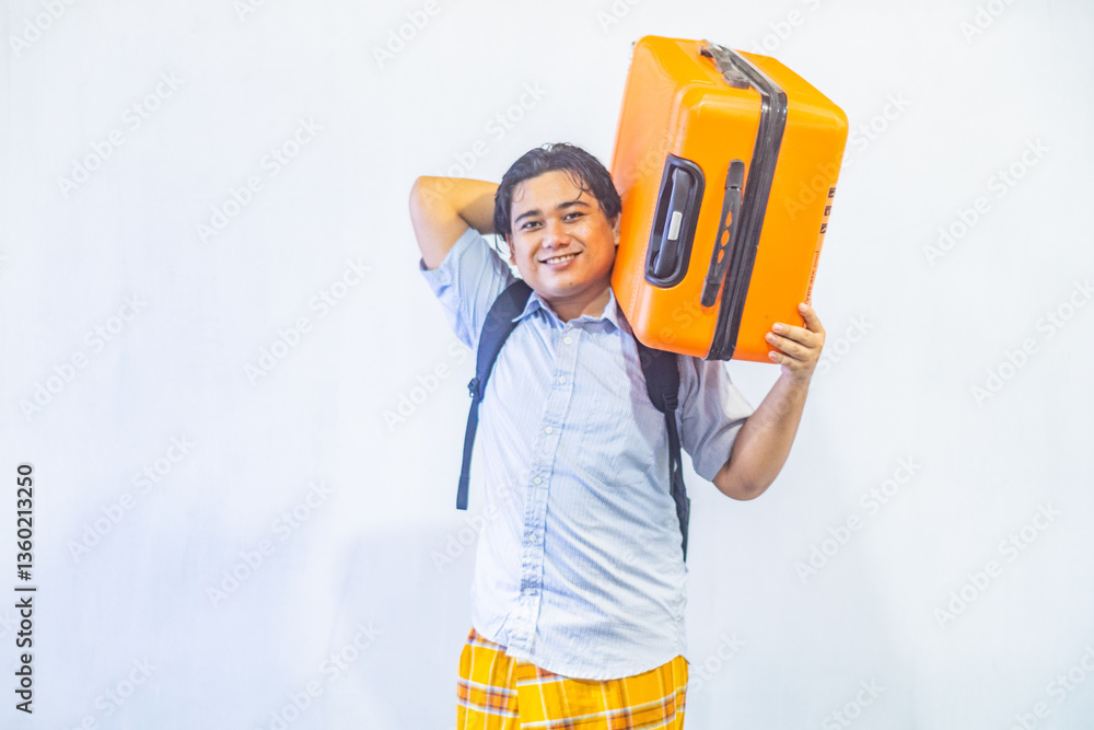 Portrait Asian muslim man carrying suitcase . Concept Going home for Eid Mubarak. Isolated image on white background