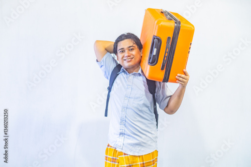 Obraz na płótnie Portrait Asian muslim man carrying suitcase . Concept Going home for Eid Mubarak. Isolated image on white background w salonie