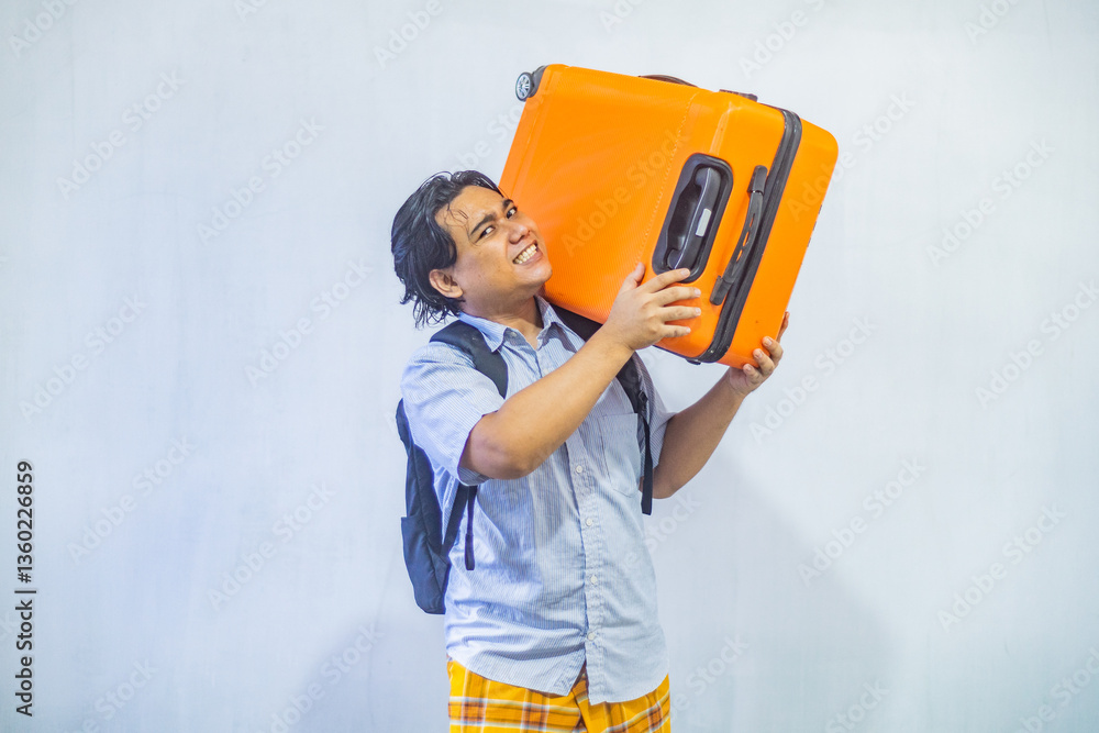 Portrait Asian muslim man carrying suitcase . Concept Going home for Eid Mubarak. Isolated image on white background