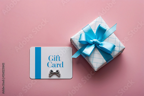 A thoughtful gift card and elegantly wrapped present, a perfect surprise for a special occasion, displayed against a soft pink background.