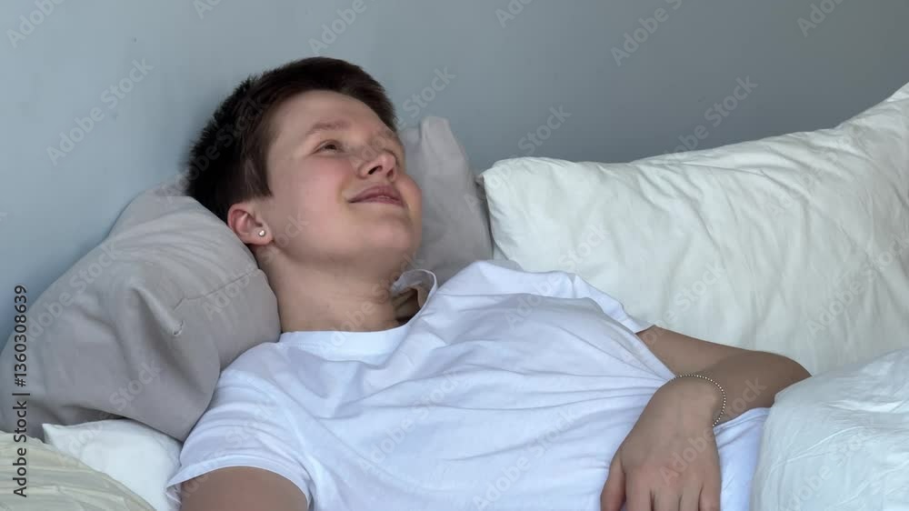 Young beautiful happy woman is sleeping well in bed in bedroom Young beautiful happy woman is sleeping well in bed in bedroom