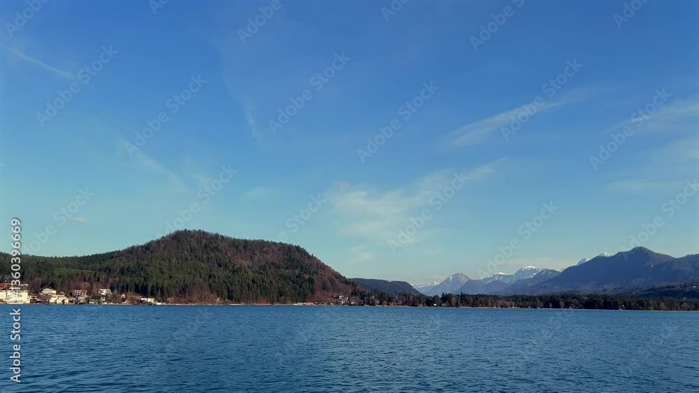 Lake Faaker See in winter with views of the Alps Lake Faaker See in winter with views of the Alps