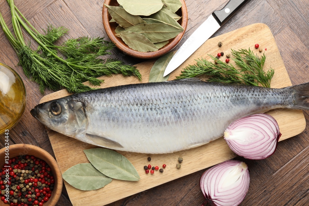 Salted herring, spices and knife on wooden table, flat lay Salted herring, spices and knife on wooden table, flat lay